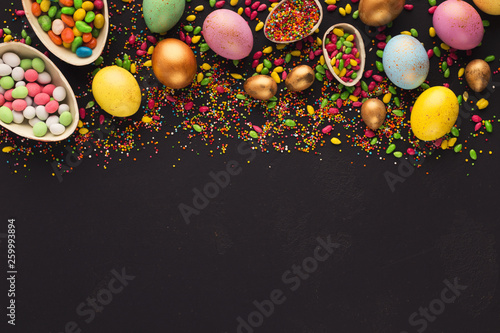 Border of colored and chocolate eggs photo