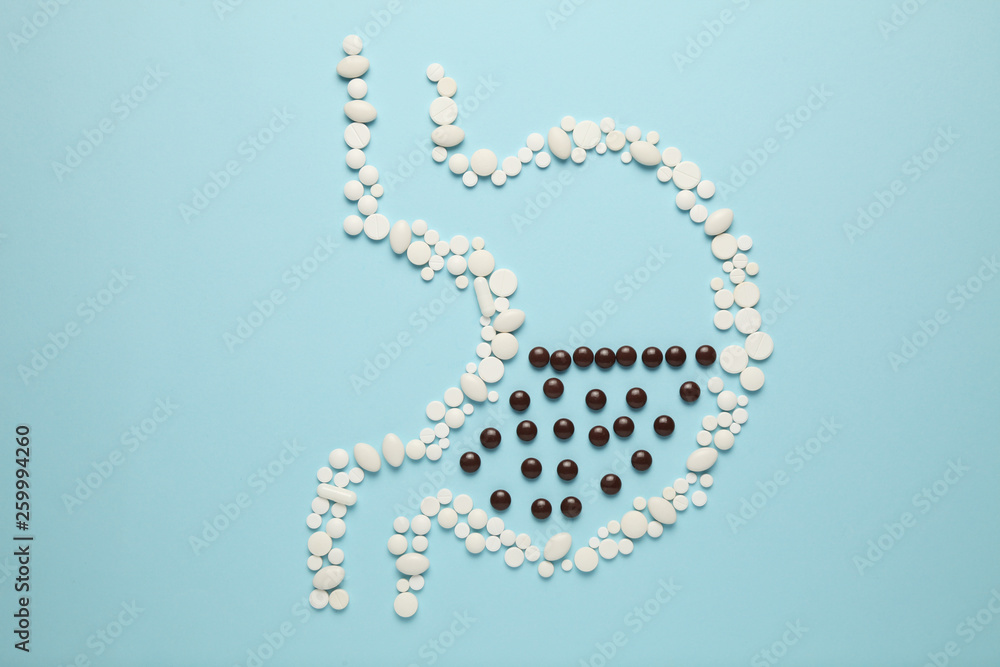 Stomach of pills, concept of food poisoning and toxins in body. Indigestion and abdominal pain. Stomach of pills, concept of food poisoning and toxins in body. Indigestion and abdominal pain.