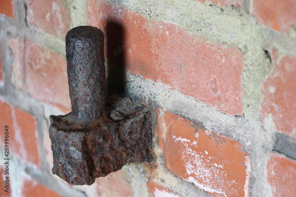 background old brick wall with old metal bracket background old brick wall with old metal bracket