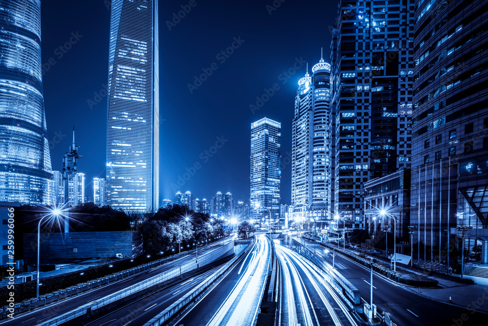 Fototapeta premium Urban Nightscape Architecture Street and Fuzzy Car Lights..