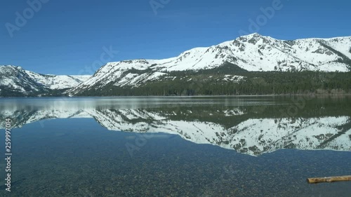 Panning morning view of Mt Tallac reflecting in Fallen Leaf Lake, South Lake Tahoe, California. photo