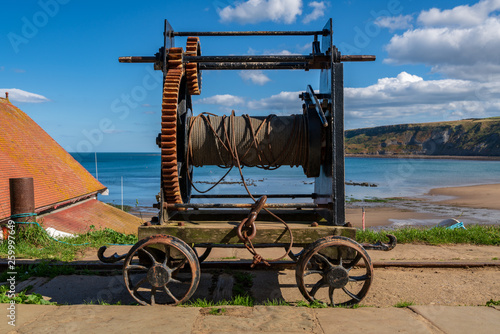 An old rope winch on the North Sea coast in Runswick Bay, North Yorkshire, England, UK photo