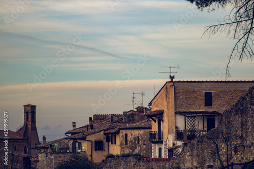 Sunset sky on a urban skyline is a small village in Tuscany, Italy