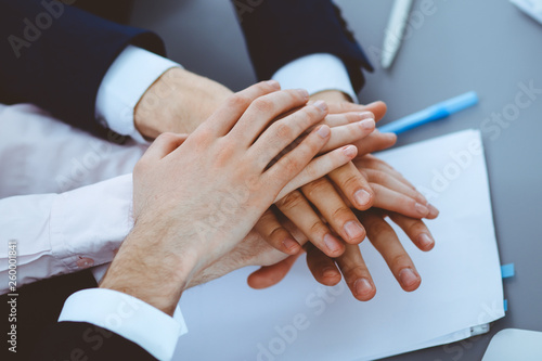 Business people group joining hands. Teamwork or meeting concepts photo