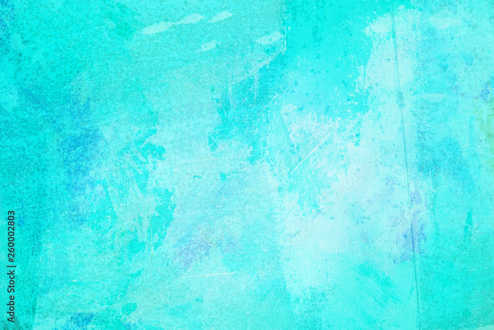 The abstract bright blue surface has a brush painted on the background for graphic design. The abstract bright blue surface has a brush painted on the background for graphic design.