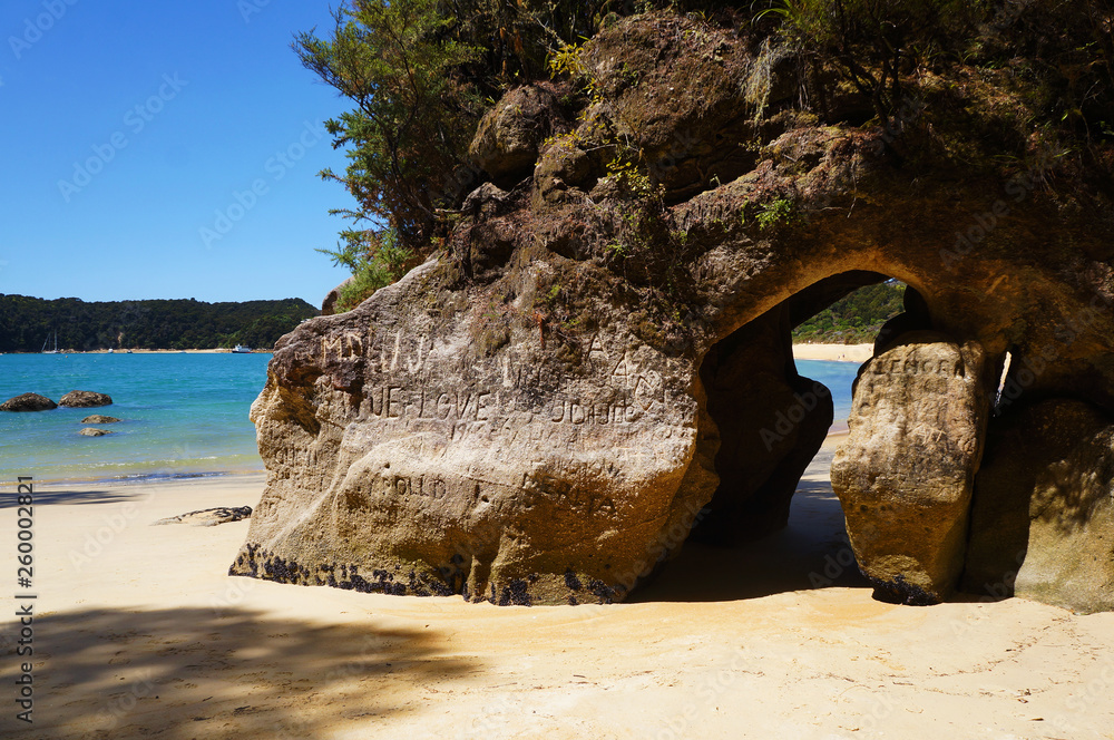Gate through rock on beach in South island in New zealand