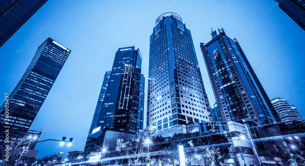 Fototapeta premium Urban Nightscape Architecture Street and Fuzzy Car Lights..