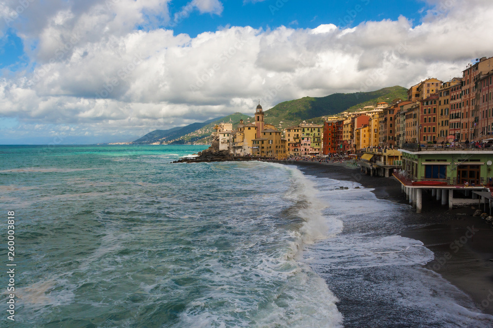 View of Camogli with its stormy sea in the Ligurian Riviera in Italy.