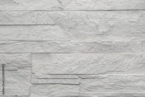 Brick wall of white-gray color, background saver.