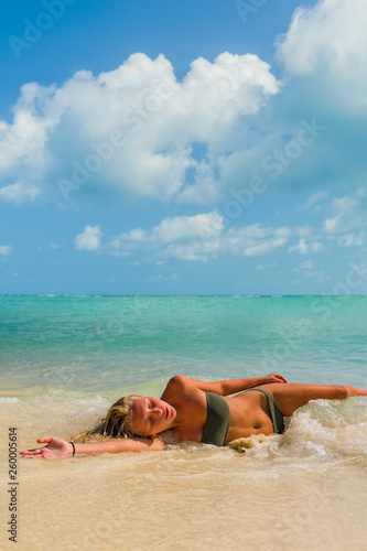 Fototapeta Naklejka Na Ścianę i Meble -  Young woman at the tropical beach