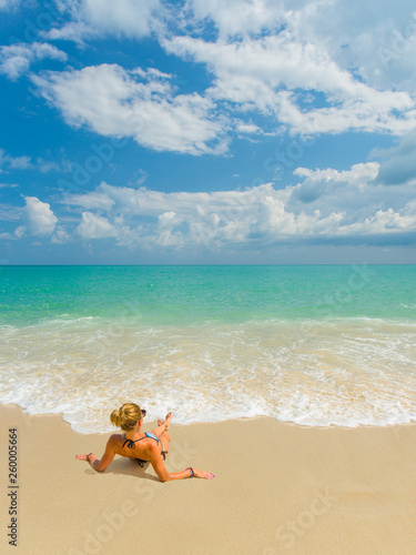 Woman enjoying her holidays on the tropical beach i © Netfalls