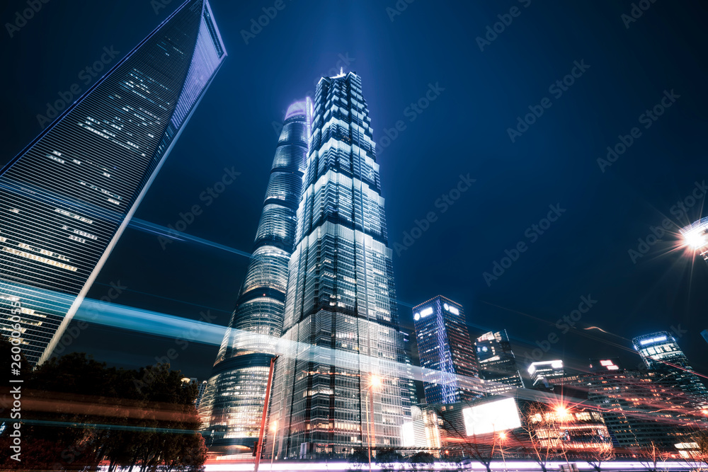 Obraz premium Urban Nightscape Architecture Street and Fuzzy Car Lights..