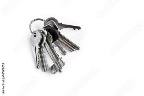 Several keys on a white isolated background,the keys to the apartment.