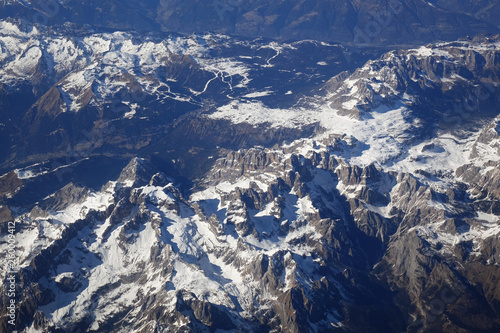Alps mountains in spring. Aerial view from air plane