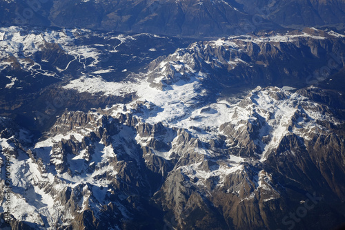 Alps mountains in spring. Aerial view from air plane