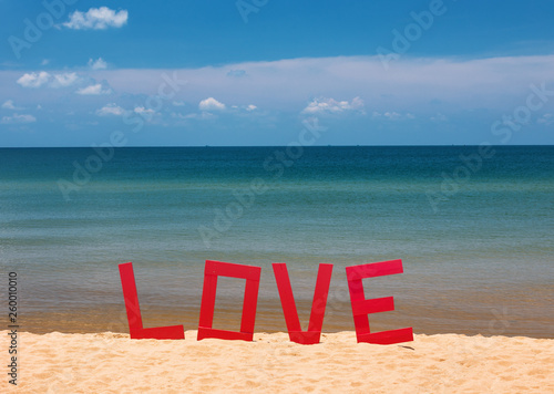 design of love letters on the beach on the sea. The concept of loves and travel. Big letters Love on the sandy beach and on the sea background