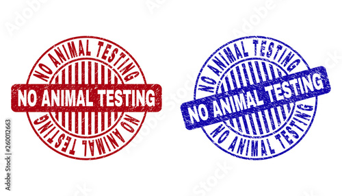 Grunge NO ANIMAL TESTING round stamp seals isolated on a white background. Round seals with grunge texture in red and blue colors.