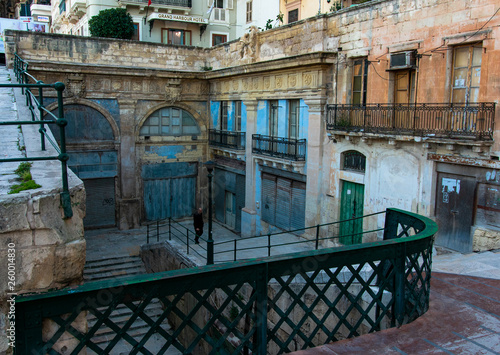 Man climbing up the stairs in Valletta, Malta