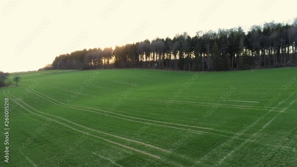 Panning from left to right over agricultural field during sunrise in Germany. Panning from left to right over agricultural field during sunrise in Germany.