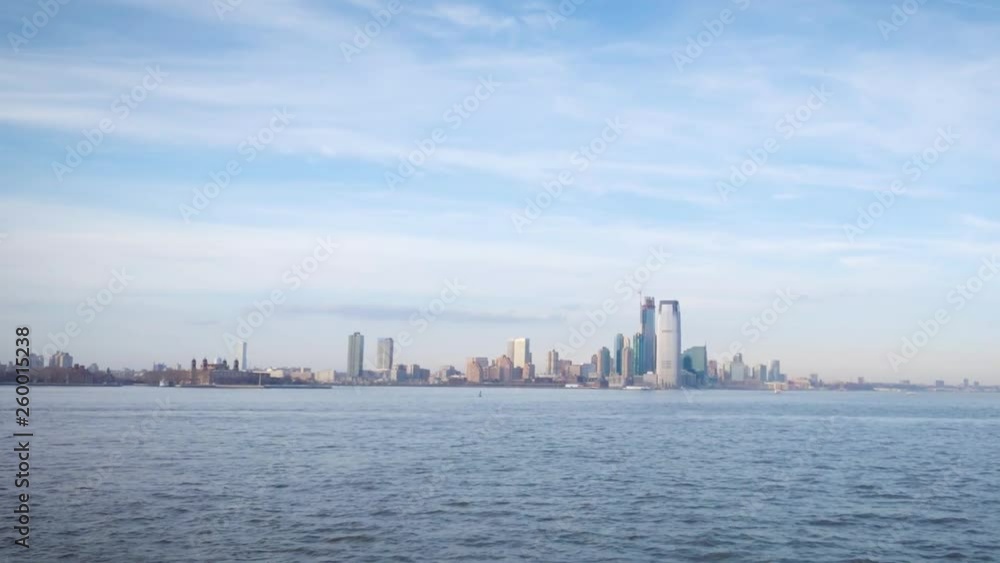 Zoom in towards Ellis Island with the New Jersey waterfront skyline in the background Zoom in towards Ellis Island with the New Jersey waterfront skyline in the background