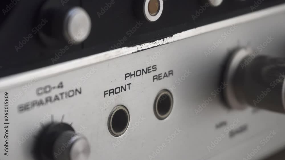 Plugging/unplugging a headphone jack, on an old and retro amplifier. Plugging/unplugging a headphone jack, on an old and retro amplifier.