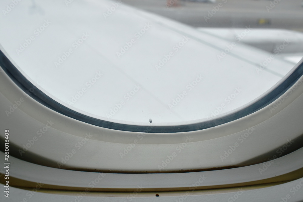  close up of plane window frame height in sky