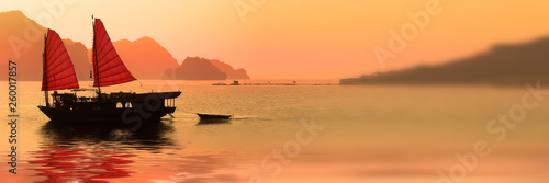Billede på lærred Junk boat at sunset in Halong Bay, Vietnam
