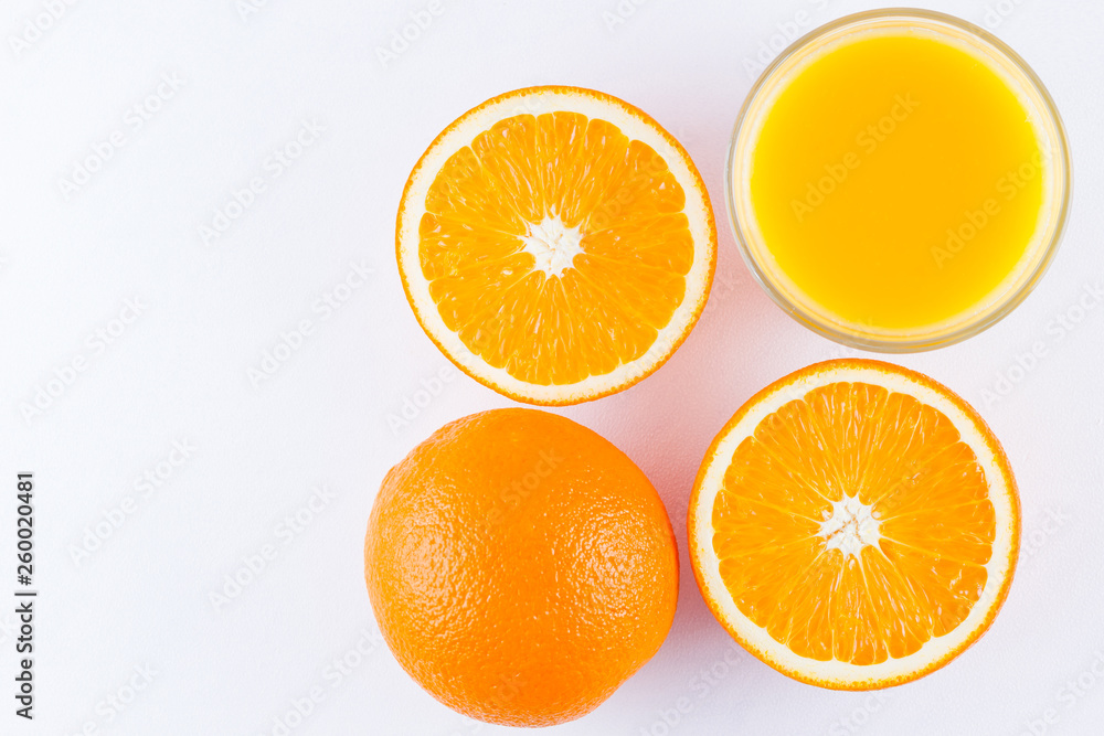 Orange fruits with juice, concept. Orange juice and halves of oranges on white background. Citrus for making juice. Whole and squeezed oranges and glass of juice Orange fruits with juice, concept. Orange juice and halves of oranges on white background. Citrus for making juice. Whole and squeezed oranges and glass of juice