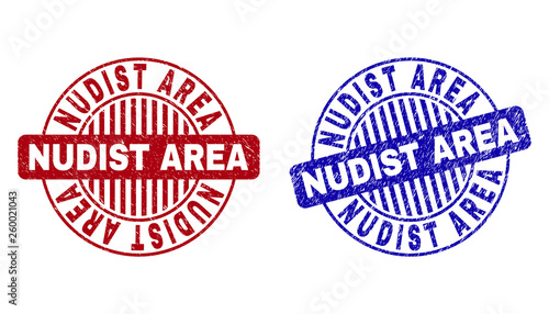 Grunge NUDIST AREA round stamp seals isolated on a white background. Round seals with grunge texture in red and blue colors.