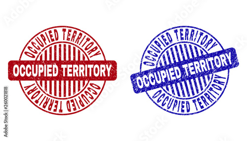 Grunge OCCUPIED TERRITORY round stamp seals isolated on a white background. Round seals with grunge texture in red and blue colors.