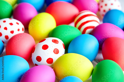 Colorful Easter eggs on wooden background
