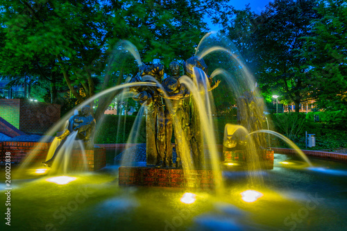 Night view of Gauklerbrunnen fountain in Stadtpark in Dortmund, Germany photo
