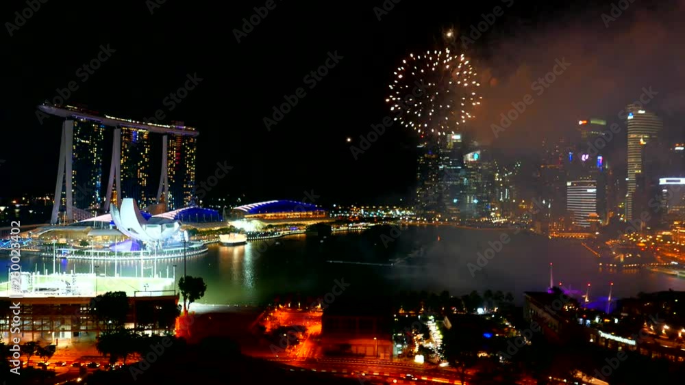 Panoramic view of Marina Bay in Singapore with fireworks at the distance. Panoramic view of Marina Bay in Singapore with fireworks at the distance.