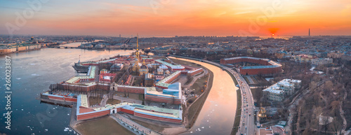 Aerial view panoramic of Peter and Paul cathedral at red sunset, walls of fortress, spring time in Saint-Petersburg. photo