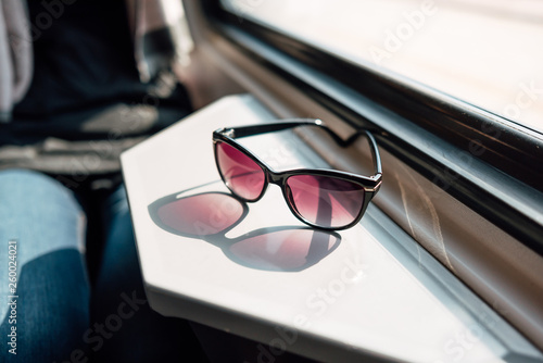fashionable sunglasses lie on metal table photo