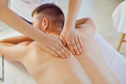 Crop master massaging man on table