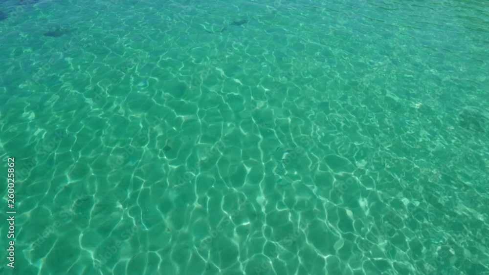 Turquoise water background on a low depth waving sea Turquoise water background on a low depth waving sea