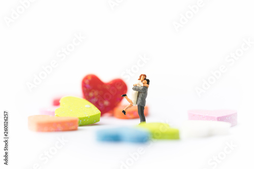 Miniature of a women and a man in love in front of heart sign with copyspace, couple in love and pre-wedding background concept