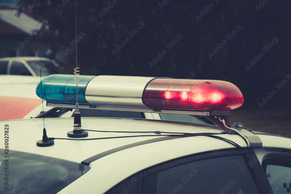 Close up of a swithched rotating beacon of a police car. The top of the