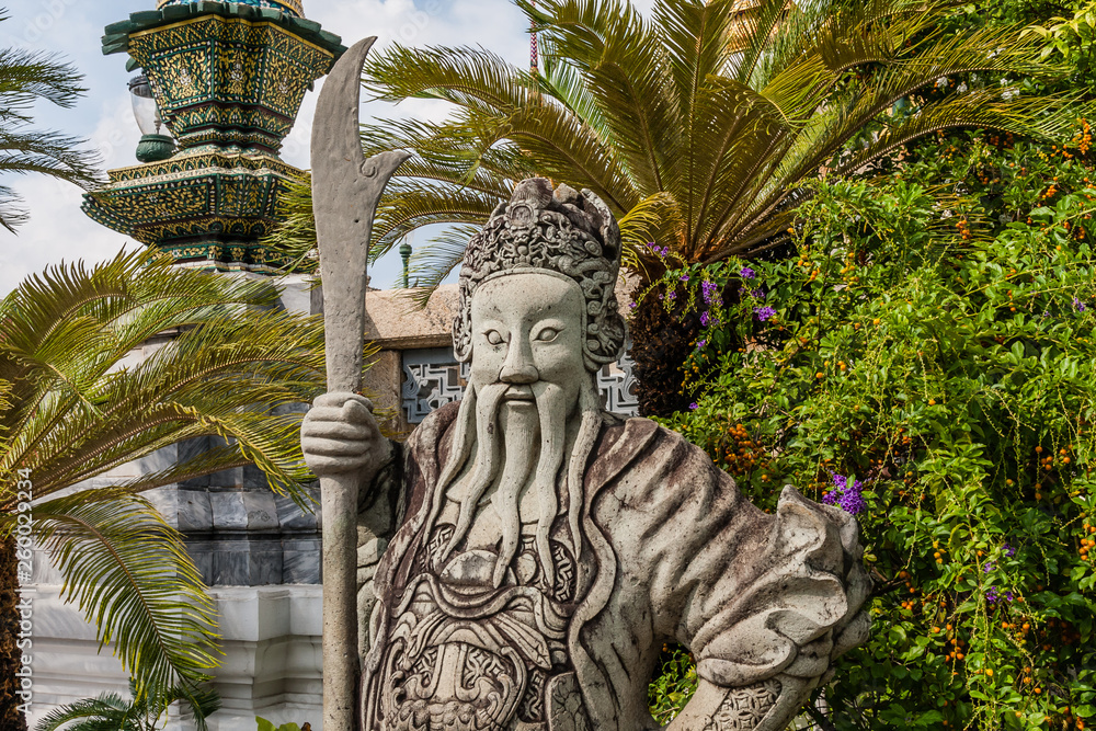 A statue of a mythological guard at the entrance to the Throne Hall, the Grand Palace, Bangkok A statue of a mythological guard at the entrance to the Throne Hall, the Grand Palace, Bangkok