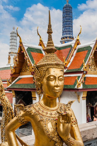 Statue of a kinnara (mythological creature, half bird, half man) in Wat Phra Kaew (The Temple of Emerald Buddha), The Grand Palace, Bangkok, Thailand.