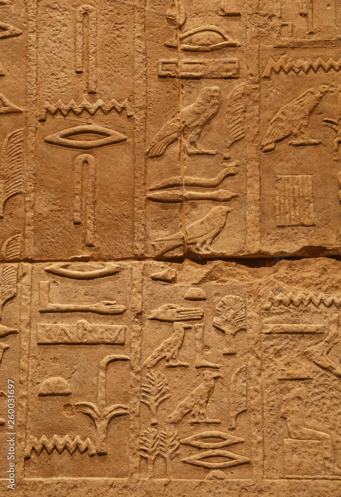 Stone wall with ancient Egyptian hieroglyphs Stone wall with ancient Egyptian hieroglyphs