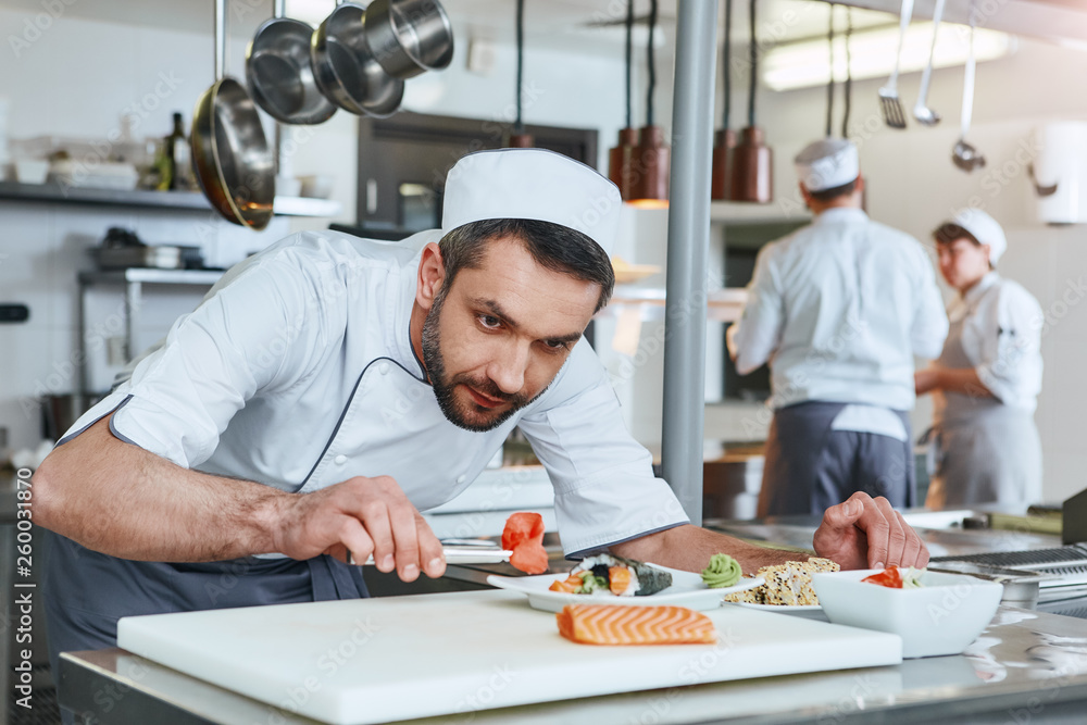 We know how to cook. Chef cook preparing japanese food in modern commerical kitchen We know how to cook. Chef cook preparing japanese food in modern commerical kitchen