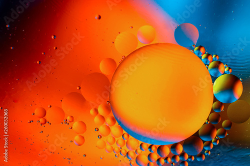 Abstract background with colorful gradient colors. Oil drops in water abstract psychedelic pattern image. Water bubbles abstract background.