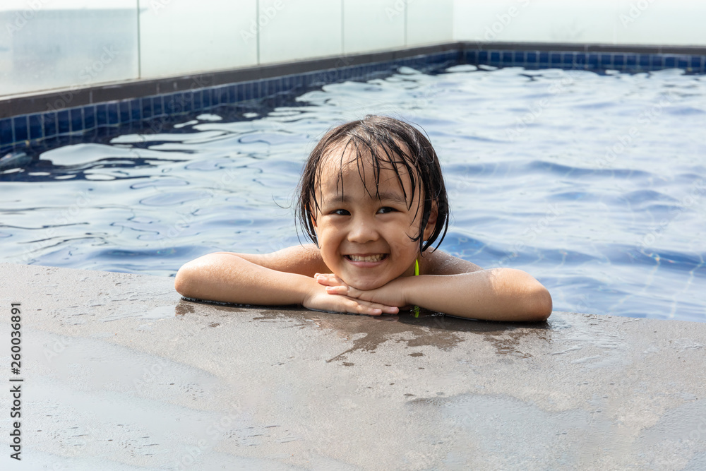 Asian Little Chinese Girl Playing in Swimming Pool Asian Little Chinese Girl Playing in Swimming Pool