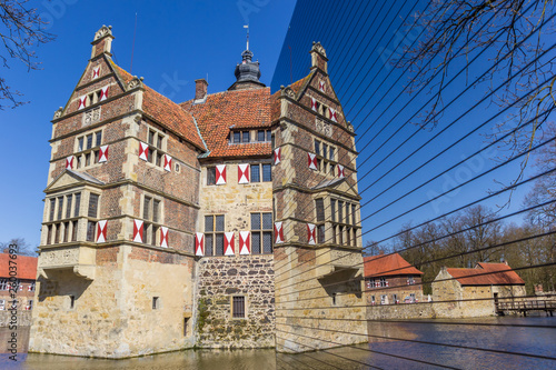 Mirror reflection of the Burg Vischering in Ludinghausen, Germany photo