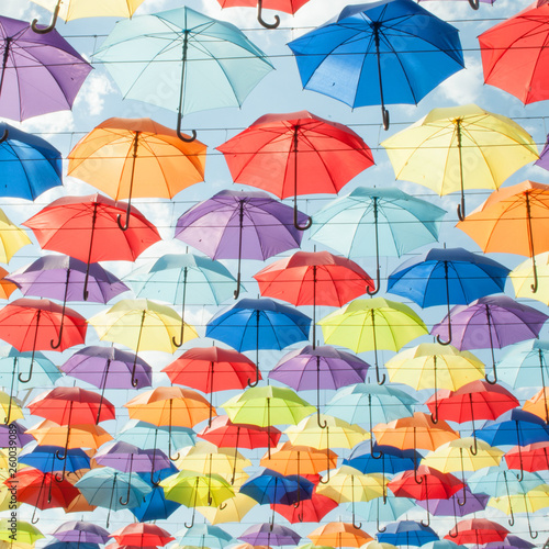 Multi-colored umbrellas against the sky