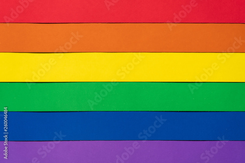 Horizontal. Multi-colored striped lgbt flag showing love without boundaries and rules. Top view