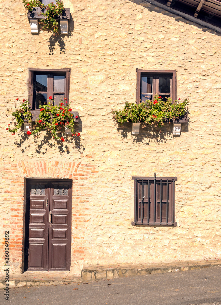Facade with flowers in the window
