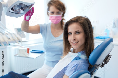 Young woman at dentist s chair